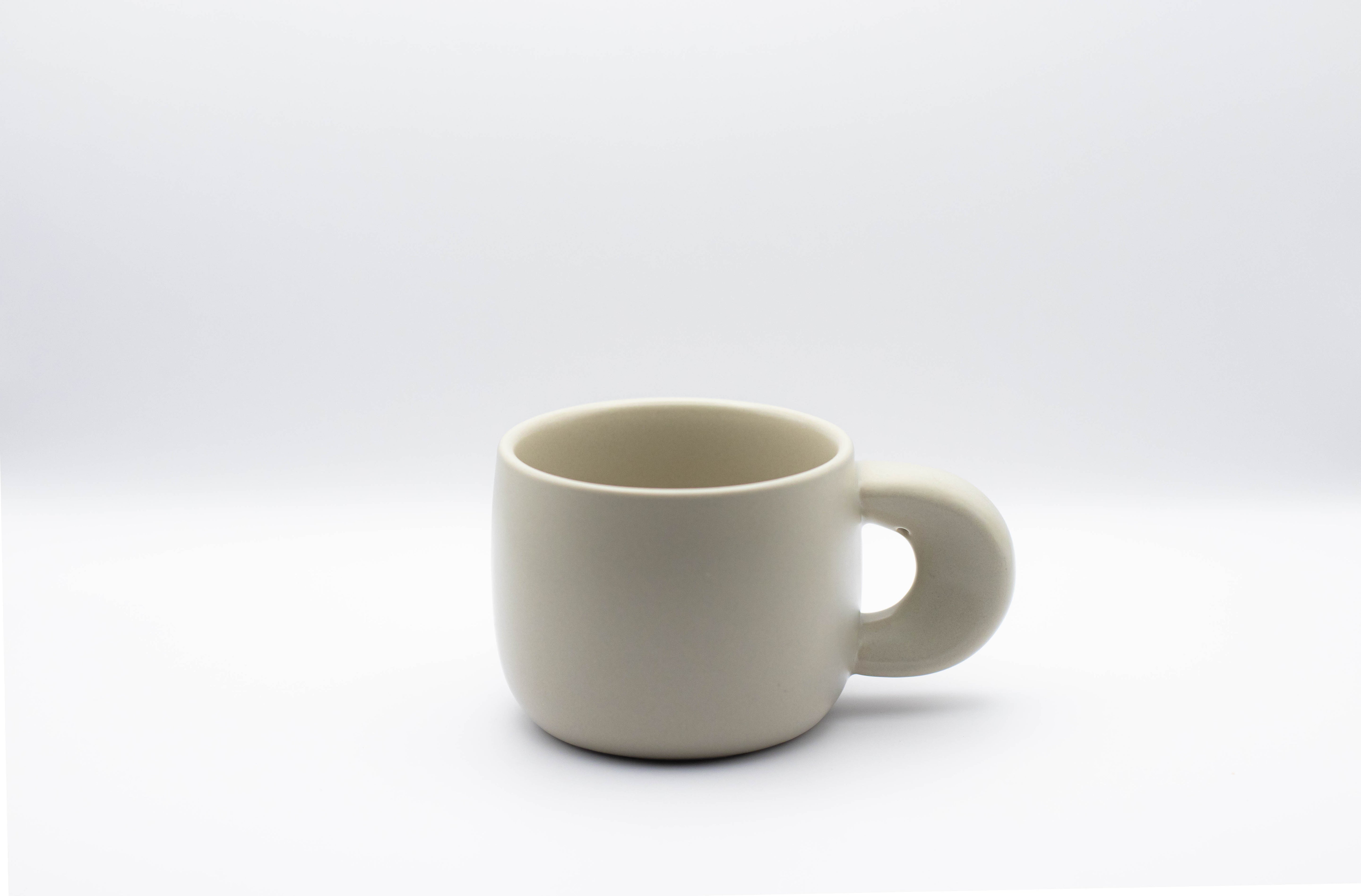 Stand-alone picture of our ceramic cup Elegance in beige color.