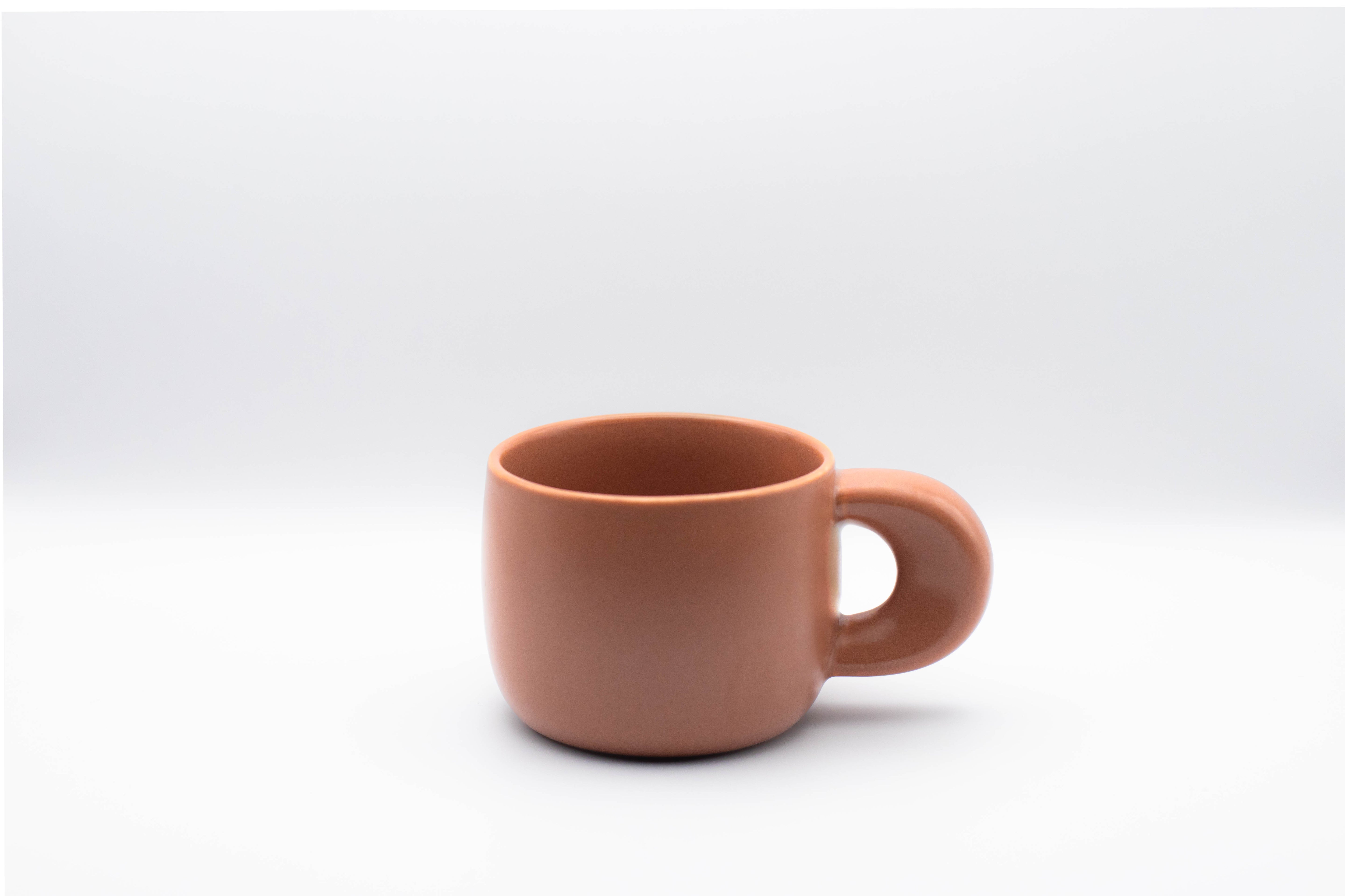 Stand-alone picture of our ceramic cup Elegance in terracotta color.