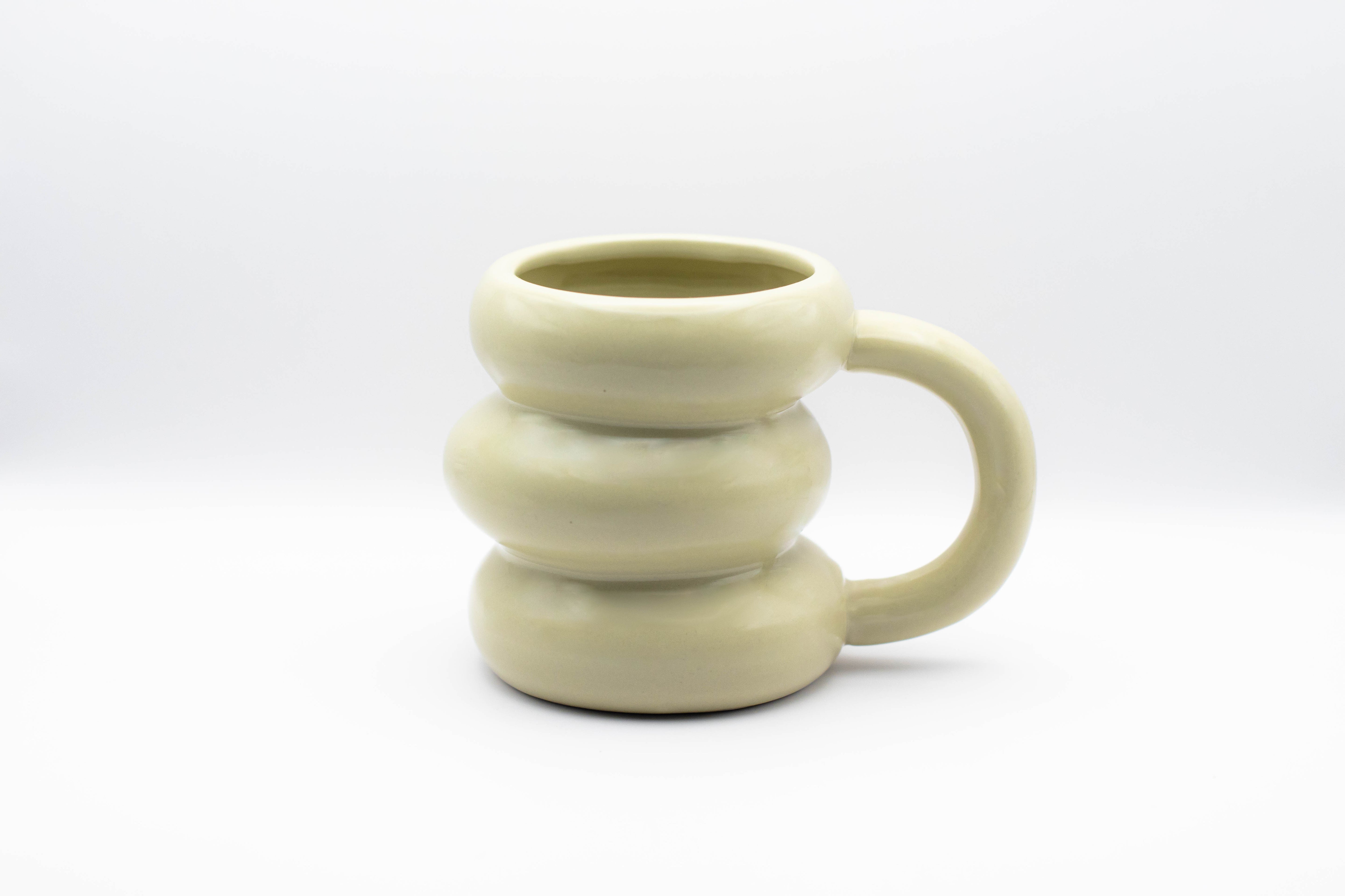 A stand-alone product picture of our Donut mug in beige. 